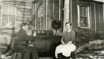 Red Deer Archives, P434; Man and woman listening to short wave radio, 192?