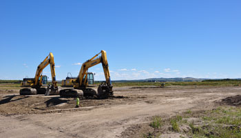 Photo of large diggers in a construction area