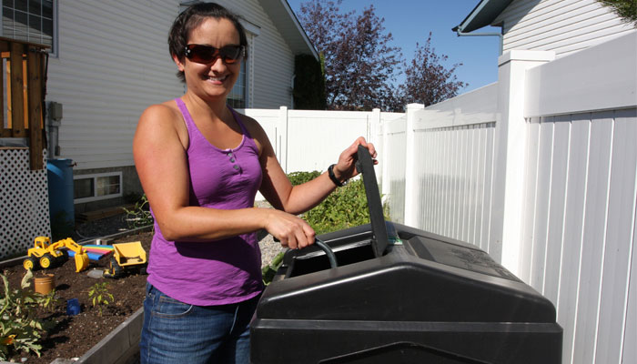 picture of woman working with her composter