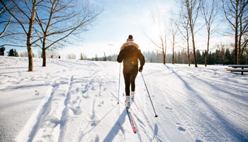 photo of woman cross-country skiing